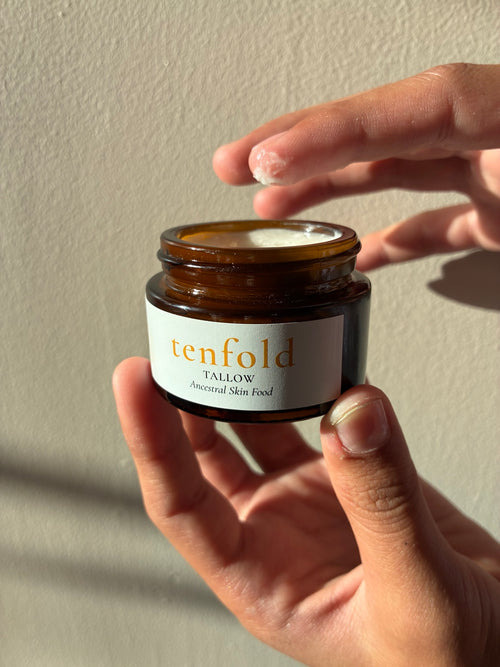 Tenfold Lavender Whipped Face Creme 1 oz jar with a small amount of creme on fingertip